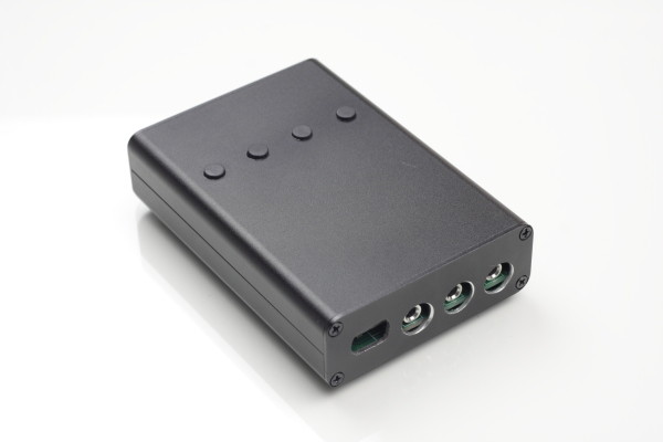 Nano-keyer in a black enclosure with 4 buttons on top and a usb-c port and 3 3.5mm stereo connectors on the back.