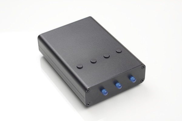 Nano-keyer in a black enclosure with 4 buttons on top and 3 blue leds on the front.